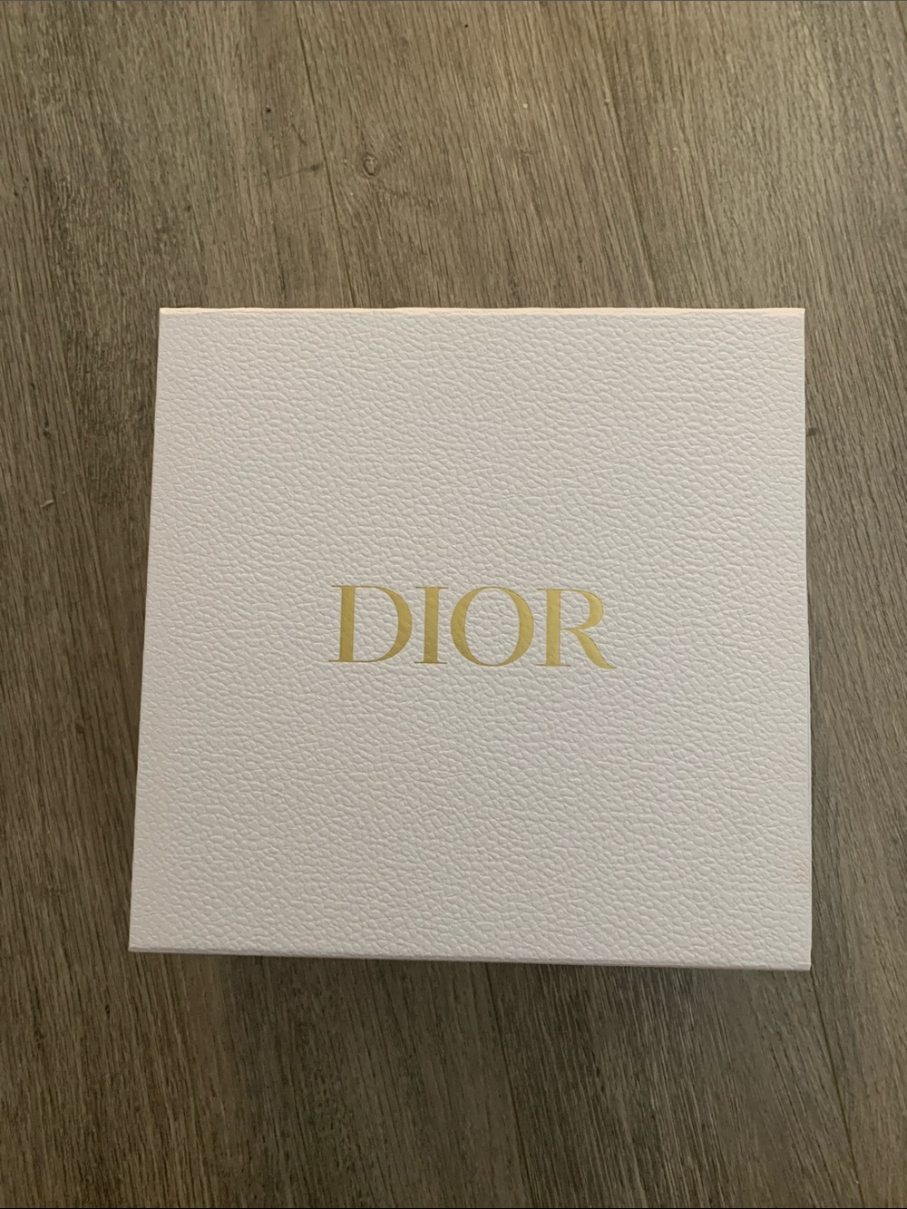DIOR box on wooden surface